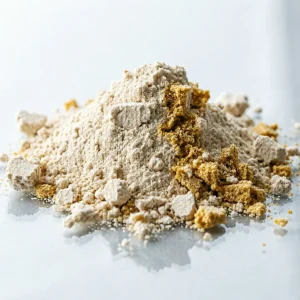 hydrolyzed-keratin-powder-close-up-yellow-beige-granules Close-up of hydrolyzed keratin protein powder, fine beige to yellow granules showing dry free-flowing texture on white background