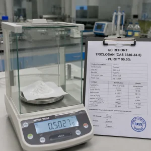 QC report of triclosan CAS 3380-34-5, HPLC purity 99.5%, PASS stamp, powder on analytical balance for oral care and institutional use