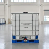 1-2-propylene-diacetate-cas-623-84-7-1000kg-ibc-tote-tank 1000kg IBC tote tank of 1,2-Propylene Diacetate CAS 623-84-7 with metal cage frame and bottom valve in a factory warehouse, labeled with product details and weight.
