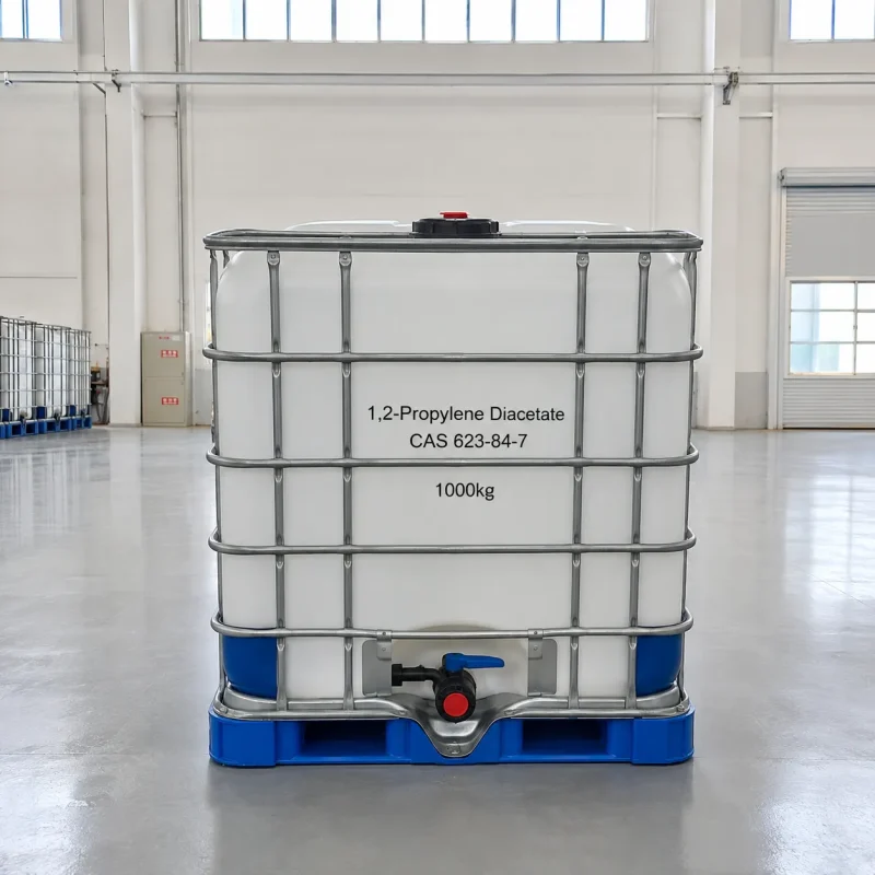 1-2-propylene-diacetate-cas-623-84-7-1000kg-ibc-tote-tank 1000kg IBC tote tank of 1,2-Propylene Diacetate CAS 623-84-7 with metal cage frame and bottom valve in a factory warehouse, labeled with product details and weight.