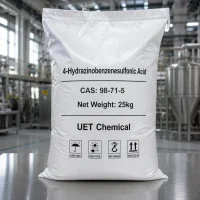 4-hydrazinobenzenesulfonic-acid-cas-98-71-5-25kg-white-woven-bag 25kg white woven bag of 4-Hydrazinobenzenesulfonic Acid CAS 98-71-5 on a metal table in a factory, featuring storage icons like keep dry and keep cool.