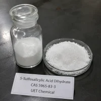 5-sulfosalicylic-acid-dihydrate-powder-sample-glass-bottle White crystalline powder of 5-Sulfosalicylic Acid Dihydrate (CAS 5965-83-3) displayed in clear glass reagent bottle and glass petri dish on dark lab surface, UET Chemical brand sample for purity verification