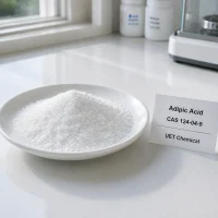 adipic-acid-cas-124-04-9-white-crystalline-powder White crystalline adipic acid powder (CAS 124-04-9) sample on a lab dish - UET Chemical