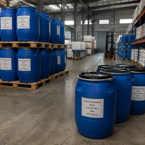 Blue plastic drums (Net Weight: 160kg) of Behenyl Dimethylamine (DMA22, CAS 21542-96-1) stacked on wooden pallets in warehouse aisle, labeled UET Chemical, industrial packaging for cationic surfactant and hair conditioner raw material