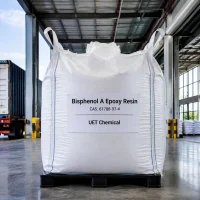 bisphenol-a-epoxy-resin-ton-bag-packaging-warehouse White ton bag of Bisphenol A Epoxy Resin CAS 61788-97-4 with UET Chemical branding, stored in a modern warehouse, suitable for bulk industrial supply.