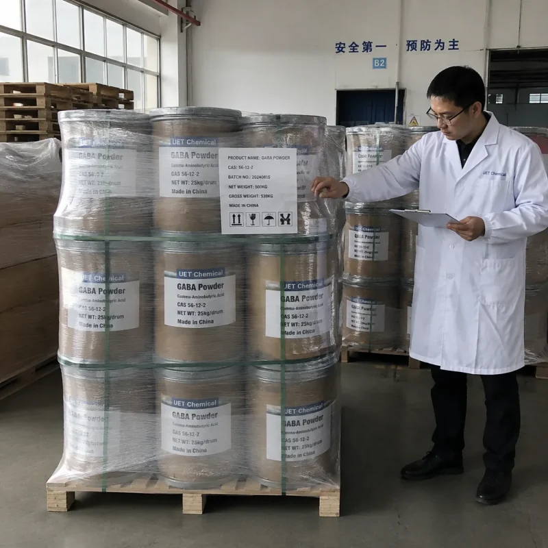 bulk-gaba-powder-25kg-drums-pallet-quality-inspection-cas-56-12-2 QC inspector at GABA gamma-aminobutyric acid powder manufacturer checking palletized 25kg drums CAS 56-12-2 for export