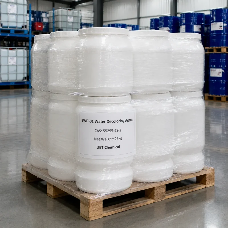 bwd-01-water-decoloring-agent-cas-55295-98-2-25kg-white-plastic-pails-shrink-wrapped Stack of 25kg white plastic pails of BWD-01 Water Decoloring Agent CAS 55295-98-2 shrink-wrapped on a wooden pallet, labeled with UET Chemical branding and net weight, with blue drums and IBC containers visible in background.