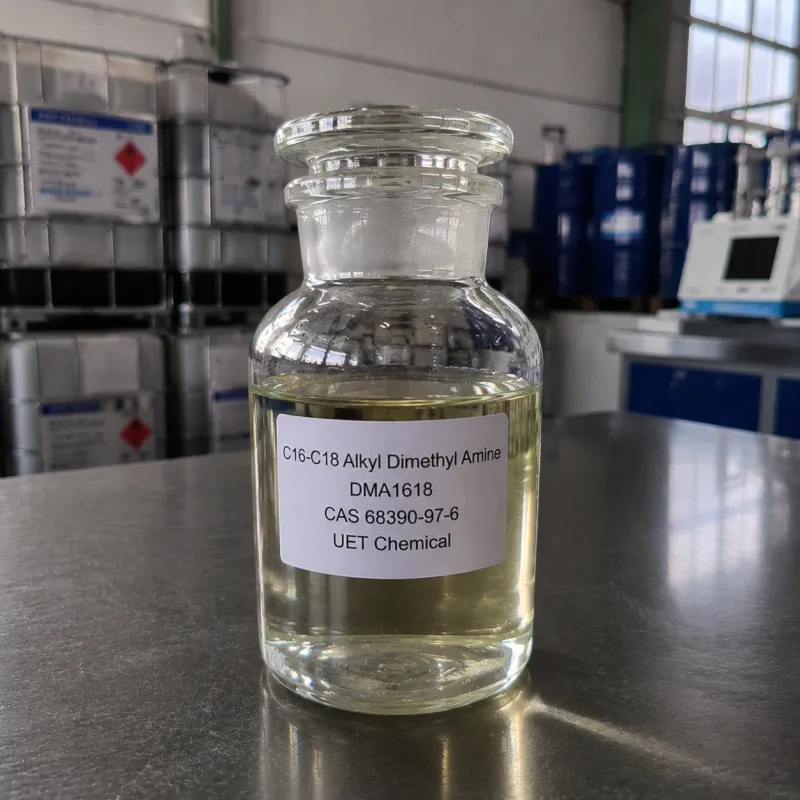 c16-c18-alkyl-dimethyl-amine-dma1618-cas-68390-97-6-sample-bottle Glass reagent bottle with ground glass stopper containing pale yellow liquid C16-C18 Alkyl Dimethyl Amine (DMA1618, CAS 68390-97-6) on stainless steel lab bench, labeled UET Chemical, IBC tanks in background