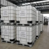 c16-c18-alkyl-dimethyl-amine-dma1618-ibc-tote-tank Stacked white IBC tote tanks with metal cages containing C16-C18 Alkyl Dimethyl Amine (DMA1618, CAS 68390-97-6) in factory yard, labeled UET Chemical, forklift visible in background, industrial bulk packaging