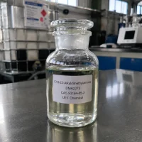 c18-22-alkyldimethylamines-dma2275-cas-93164-85-3-sample-bottle Glass reagent bottle with ground glass stopper containing pale yellow liquid C18-22-Alkyldimethylamines (DMA2275, CAS 93164-85-3) on stainless steel lab bench, labeled UET Chemical, IBC tank visible in background