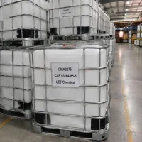 c18-22-alkyldimethylamines-dma2275-ibc-tote-tank-storage Stacked white IBC tote tanks with metal cages filled with DMA2275 (C18-22-Alkyldimethylamines, CAS 93164-85-3) in warehouse storage area, labeled UET Chemical, ready for bulk shipment