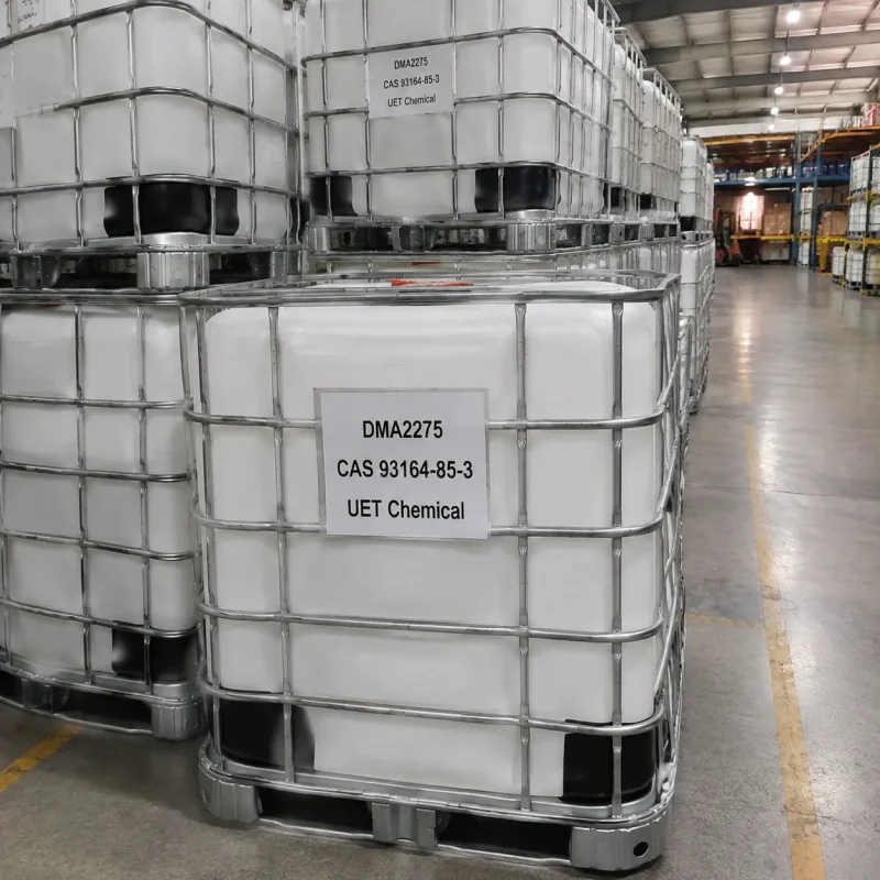 c18-22-alkyldimethylamines-dma2275-ibc-tote-tank-storage Stacked white IBC tote tanks with metal cages filled with DMA2275 (C18-22-Alkyldimethylamines, CAS 93164-85-3) in warehouse storage area, labeled UET Chemical, ready for bulk shipment