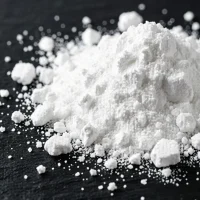 calcium-propionate-cas-4075-81-4-white-powder-macro-closeup Macro close-up of white crystalline Calcium Propionate CAS 4075-81-4 powder and lumps on a dark stone background, showcasing its fine physical texture and purity as a food and feed preservative.