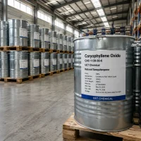 caryophyllene-oxide-cas-1139-30-6-180kg-silver-metal-drum-bulk-supply Large silver metal drum containing 180kg of Caryophyllene Oxide CAS 1139-30-6 liquid on a wooden pallet, with rows of stock visible in the background.
