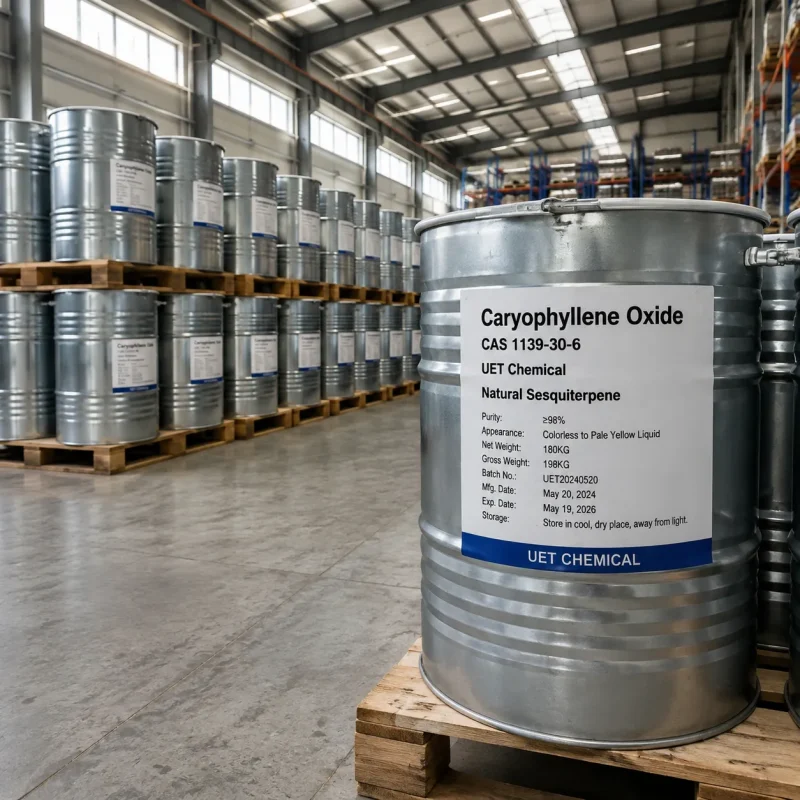 caryophyllene-oxide-cas-1139-30-6-180kg-silver-metal-drum-bulk-supply Large silver metal drum containing 180kg of Caryophyllene Oxide CAS 1139-30-6 liquid on a wooden pallet, with rows of stock visible in the background.