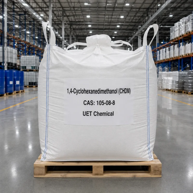 chdm-cas-105-08-8-ton-bag-fibc-bulk-packaging Large white FIBC ton bag of 1,4-Cyclohexanedimethanol (CHDM) CAS 105-08-8 on a wooden pallet in a warehouse, labeled with UET Chemical branding for bulk shipment.