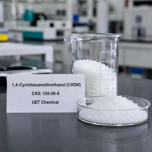 chdm-cas-105-08-8-white-granular-sample-lab White granular sample of 1,4-Cyclohexanedimethanol (CHDM) CAS 105-08-8 in a glass beaker and petri dish on a lab bench, with product label showing UET Chemical branding.