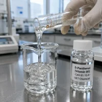 dexpanthenol-vitamin-b5-cas-81-13-0-clear-viscous-liquid-sample Clear viscous D-Panthenol (Vitamin B5, CAS 81-13-0) cosmetic active poured into a beaker beside a UET sample vial in lab