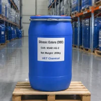 dibasic-esters-dbe-cas-95481-62-2-200kg-blue-plastic-drum Blue plastic drum of Dibasic Esters (DBE) CAS 95481-62-2 on a wooden pallet in a warehouse, label showing 200kg net weight and UET Chemical branding, with stacked drums visible in the background.
