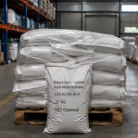 dibenzoyl-l-tartaric-acid-monohydrate-25kg-bag-warehouse Stack of 25kg white woven bags of Dibenzoyl-L-Tartaric Acid Monohydrate (CAS 62708-56-9) on wooden pallet in industrial warehouse, UET Chemical brand