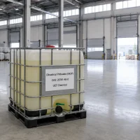diisodecyl-phthalate-didp-cas-26761-40-0-ibc-tote-bulk-packaging Bulk packaging of Diisodecyl Phthalate (DIDP) CAS 26761-40-0 in a white IBC tote with metal cage, labeled with UET Chemical brand in an industrial warehouse.