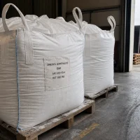 dimethyl-isophthalate-dmi-cas-1459-93-4-1000kg-ton-bags 1000kg FIBC ton bags of Dimethyl Isophthalate DMI CAS 1459-93-4 on pallets at loading dock, ready for truck loading