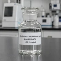 dimethylaminoethyl-methacrylate-cas-2867-47-2-clear-liquid-sample-glass-bottle Clear liquid sample of Dimethylaminoethyl Methacrylate CAS 2867-47-2 in a transparent glass bottle with ground-glass stopper on a lab bench, label showing product name and CAS number.