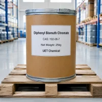 diphenyl-bismuth-chromate-cas-102-06-7-25kg-fiber-drum-packaging Brown fiber drum of Diphenyl Bismuth Chromate CAS 102-06-7 with white label showing net weight 25kg and UET Chemical branding, placed on a wooden pallet in a warehouse.