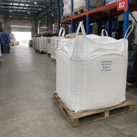 Large white FIBC bulk bag containing Ergothioneine CAS 497-30-3 on a pallet in the warehouse, industrial scale supply for pharmaceutical or cosmetic applications by UET Chemical.