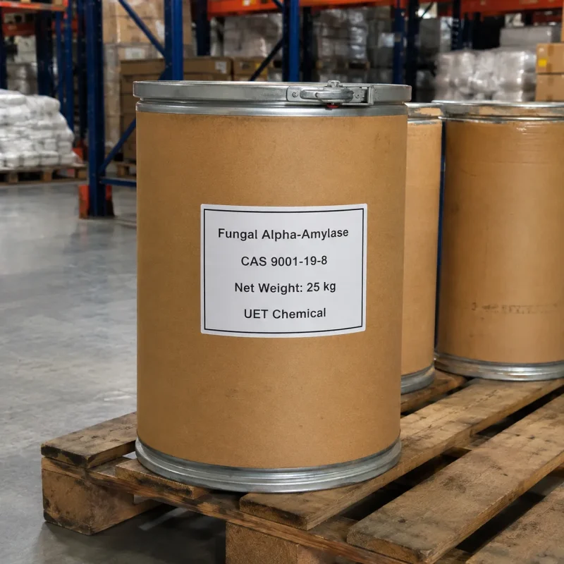 Brown fiber drums with metal lids containing 25kg Fungal Alpha-Amylase CAS 9001-19-8 stacked on wooden pallets in warehouse, standard industrial packaging by UET Chemical.