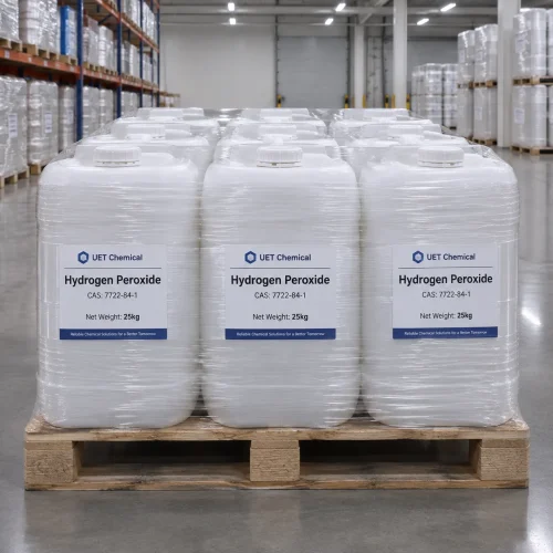 hydrogen-peroxide-cas-7722-84-1-25kg-plastic-jerrycan-pallet-shrink-wrap Stack of 25kg white plastic jerrycans of Hydrogen Peroxide CAS 7722-84-1 on wooden pallet, shrink-wrapped for stability, labeled with UET Chemical branding in warehouse setting.