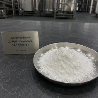 hydroxyecdysone-20-hydroxyecdysone-cas-5289-74-7-white-powder-sample-factory Close-up view of white crystalline Hydroxyecdysone (20-Hydroxyecdysone) CAS 5289-74-7 powder in a metal dish with stainless steel reactors in background, high purity plant extract from UET Chemical.