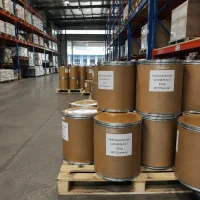 hydroxyecdysone-cas-5289-74-7-25kg-drum-warehouse-stock-ready Pallets of 25kg fiber drums labeled Hydroxyecdysone CAS 5289-74-7 stacked in the warehouse aisle, showing large stock availability and ready for export by UET Chemical.
