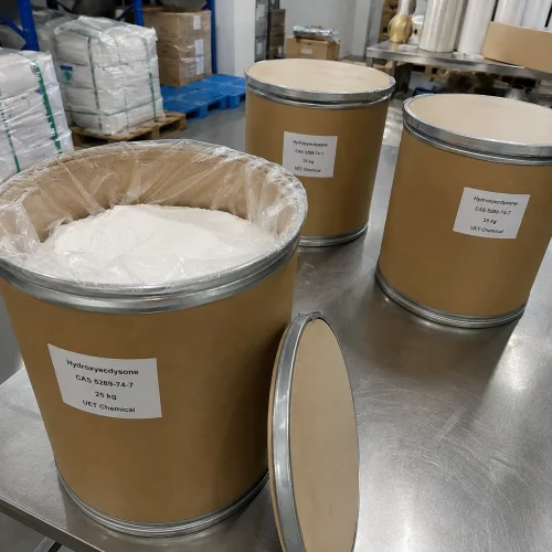 hydroxyecdysone-cas-5289-74-7-25kg-fiber-drum-open-white-powder Open brown fiber drum revealing white powder Hydroxyecdysone CAS 5289-74-7 with plastic inner liner, 25kg standard packaging solution from UET Chemical manufacturer.