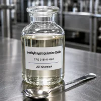 isoalkyloxypropylamine-oxide-cas-218141-49-2-laboratory-sample-uetchmical Clear glass reagent bottle containing Isoalkyloxypropylamine Oxide CAS 218141-49-2 liquid sample on a stainless steel table, showcasing purity for industrial surfactant applications by UET Chemical.