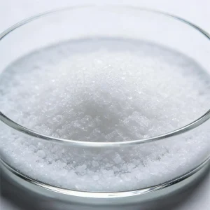 maleic-anhydride-cas-108-31-6-white-crystals-laboratory-sample Close-up laboratory sample of Maleic Anhydride (CAS 108-31-6) white crystalline powder in a glass petri dish, demonstrating the fine particle texture and strict quality control assurance.
