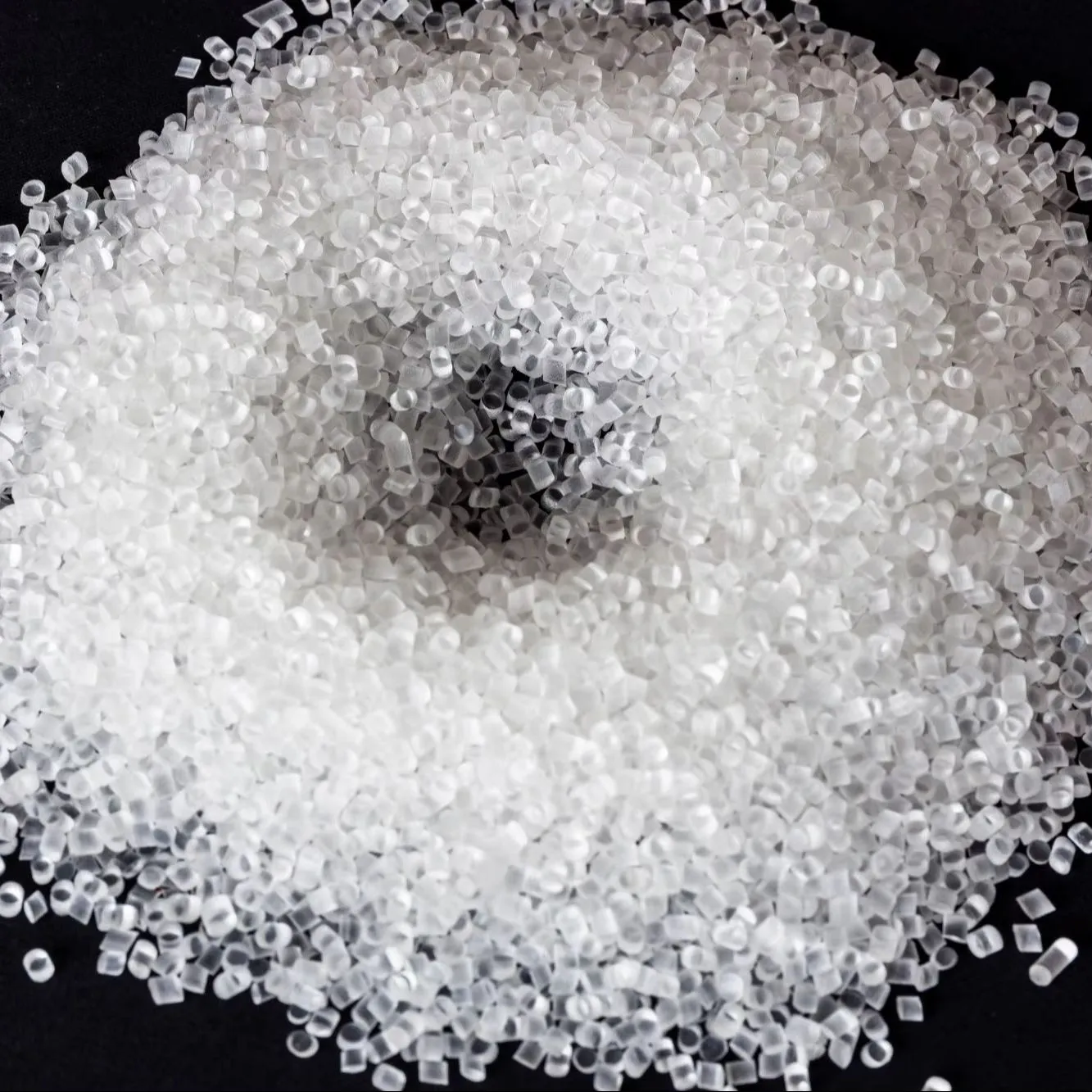 Bulk white pellets of Maleic Anhydride (CAS 108-31-6) piled on a dark surface, showcasing the high-purity appearance of this essential raw material for unsaturated polyester resins and chemical coatings.