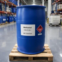 methanol-methyl-alcohol-blue-drum-flammable-liquid-un1230 Large blue plastic drum of Methanol (CAS 67-56-1) on wooden pallet in warehouse, labeled UET Chemical with flammable liquid hazard symbol (UN 1230), bulk packaging for industrial solvent and fuel applications
