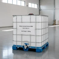 methyl-isobutyl-ketone-mibk-cas-108-10-1-1000kg-white-ibc-tote 1000kg white IBC tote of Methyl Isobutyl Ketone MIBK CAS 108-10-1 with metal frame and bottom valve on a blue pallet in a bright warehouse, label showing product name and net weight.