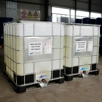 methyl-salicylate-cas-119-36-8-ibc-tote-bulk-container-warehouse Two white IBC totes with metal cages containing liquid Methyl Salicylate (CAS 119-36-8) in warehouse, labeled UET Chemical with GHS hazard labels, ready for bulk export shipping