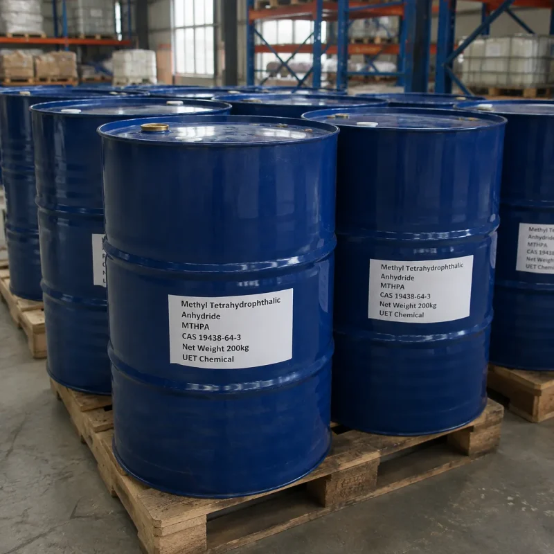Row of blue plastic drums (Net Weight: 200kg each) containing Methyl Tetrahydrophthalic Anhydride (MTHPA, CAS 19438-64-3) stacked on wooden pallets in warehouse, labeled UET Chemical, industrial bulk packaging for epoxy curing agent distribution