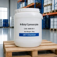 n-butyl-cyanoacrylate-cas-6606-65-1-25kg-white-plastic-pail White plastic pail of N-Butyl Cyanoacrylate CAS 6606-65-1 sitting on a wooden pallet in a warehouse, labeled with Net Weight 25kg and UET Chemical logo.