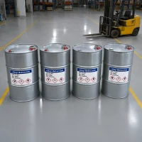 n-butyl-methacrylate-cas-97-88-1-palletized-drums-shipment-uet-chemical Stretch-wrapped pallet of n-butyl methacrylate (CAS 97-88-1) drums secured with yellow strapping bands, ready for loading beside UET Chemical delivery truck