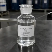 n-methylformamide-nmf-liquid-sample-bottle Clear glass reagent bottle containing colorless liquid N-Methylformamide (NMF, CAS 123-39-7) on stainless steel lab table, labeled UET Chemical, sample for purity and solvent property demonstration