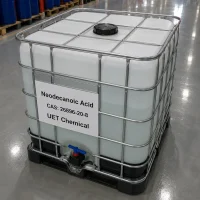 neodecanoic-acid-cas-26896-20-8-ibc-tote-tank-packaging IBC tote tank of Neodecanoic Acid CAS 26896-20-8 with metal cage frame, blue discharge valve, and black base pallet, labeled with product name, CAS number, and UET Chemical branding in a warehouse environment.