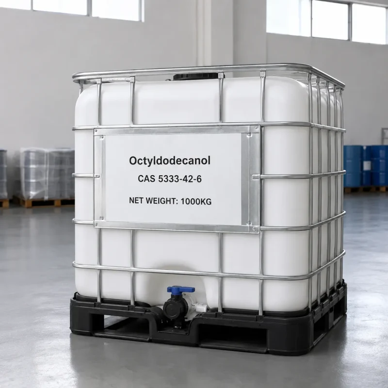 octyldodecanol-cas-5333-42-6-1000kg-ibc-ton-container-packaging Large white IBC ton container of Octyldodecanol CAS 5333-42-6 with metal frame and bottom valve, labeled with product name, CAS number, and 1000kg net weight, positioned in spacious industrial warehouse.