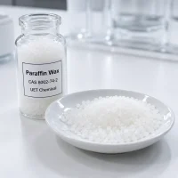 paraffin-wax-granules-lab-sample-cas-8002-74-2 White paraffin wax granules in glass lab bottle and white dish, CAS 8002-74-2, UET Chemical brand, for candle making and industrial use