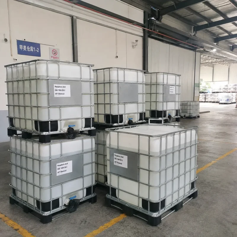 phosphoric-acid-cas-7664-38-2-ibc-tote-bulk-warehouse-storage Large IBC tote containers stacked in a chemical warehouse holding bulk Phosphoric Acid CAS 7664-38-2, ready for export shipment, bulk supplier UET Chemical.
