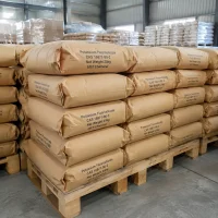 potassium-fluorosilicate-cas-16871-90-2-25kg-paper-bag-pallet Stacked brown kraft paper bags (Net Weight: 25kg each) of Potassium Fluorosilicate (CAS 16871-90-2) on wooden pallets in warehouse, all printed with UET Chemical logo, bulk packaging for export and industrial supply