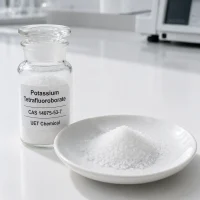 potassium-tetrafluoroborate-cas-14075-53-7-white-crystals White potassium tetrafluoroborate crystals CAS 14075-53-7 in glass reagent bottle and porcelain dish, UET Chemical lab
